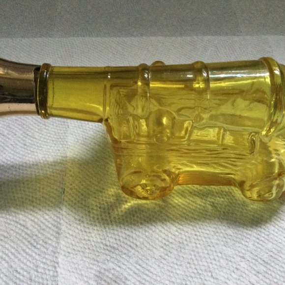Glass bottle empty yellow amber cannon shape AVON? - Picture 2 of 5